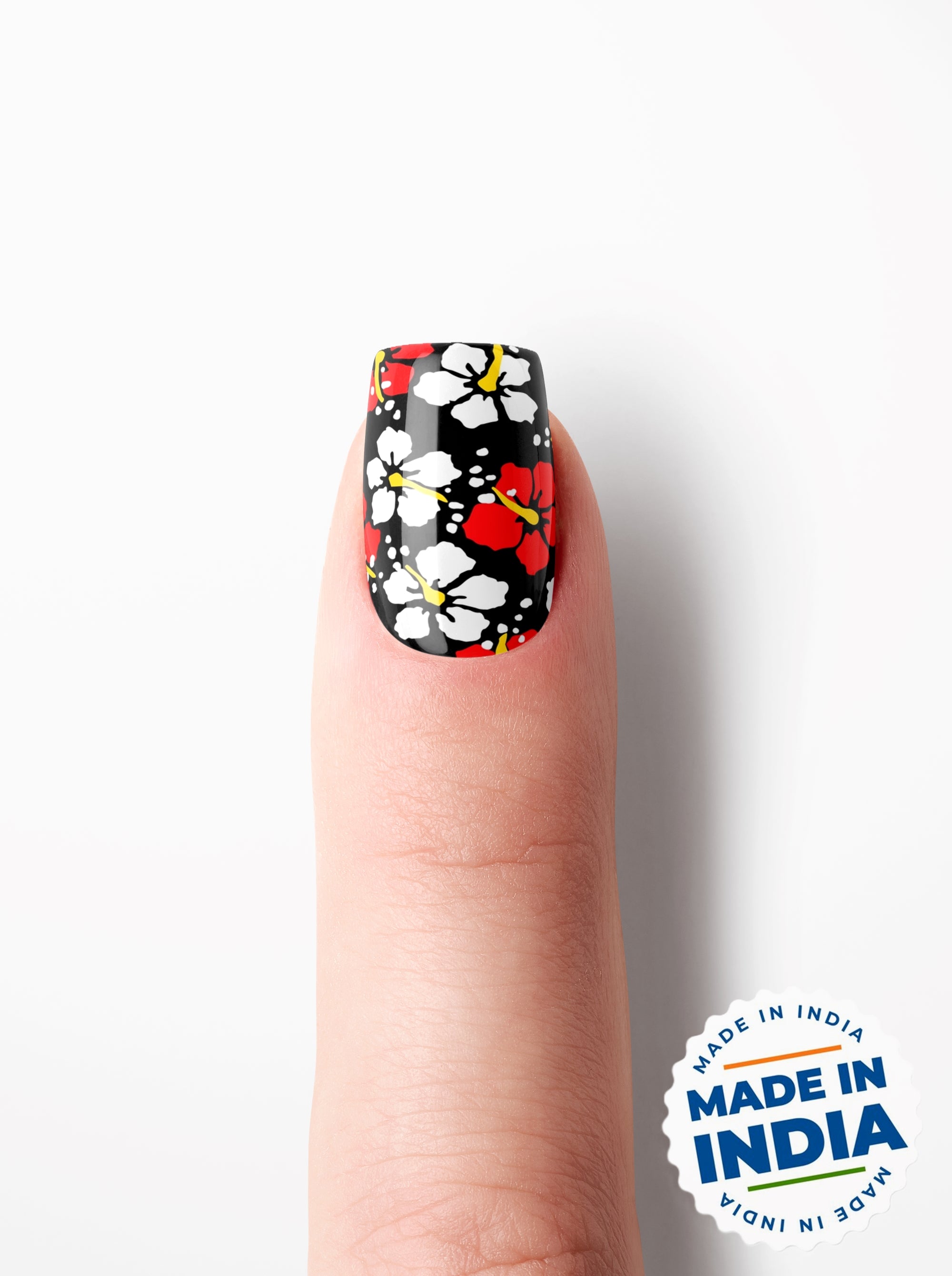 Nail with floral design on a white background, featuring 'Made in India' badge.