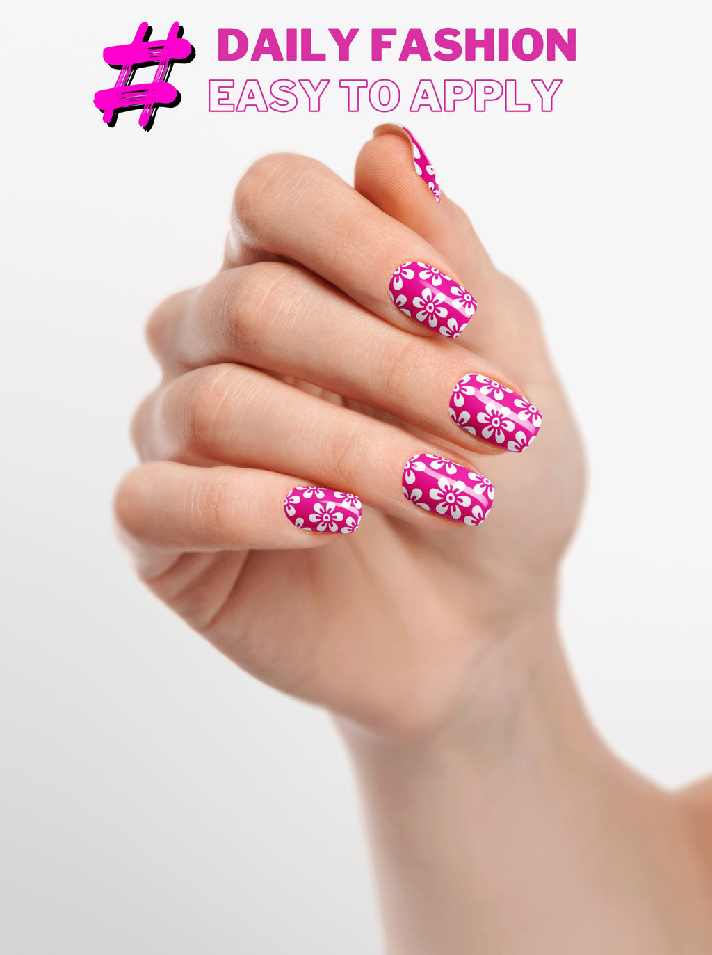 Hand with pink floral nail design on a white background