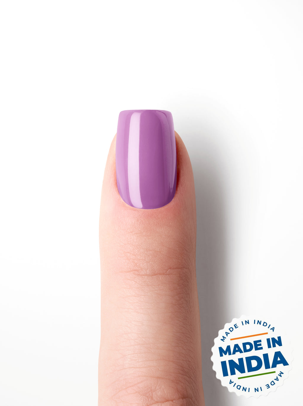 Purple nail polish on a finger with 'Made in India' label