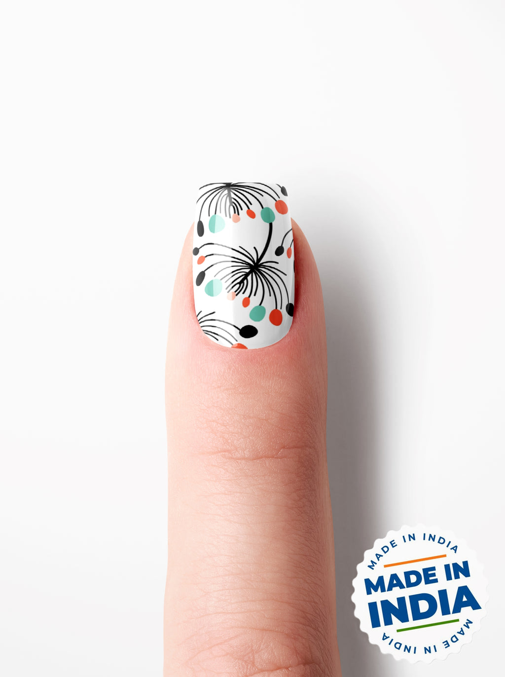Nail with floral design on a white background with 'Made in India' label