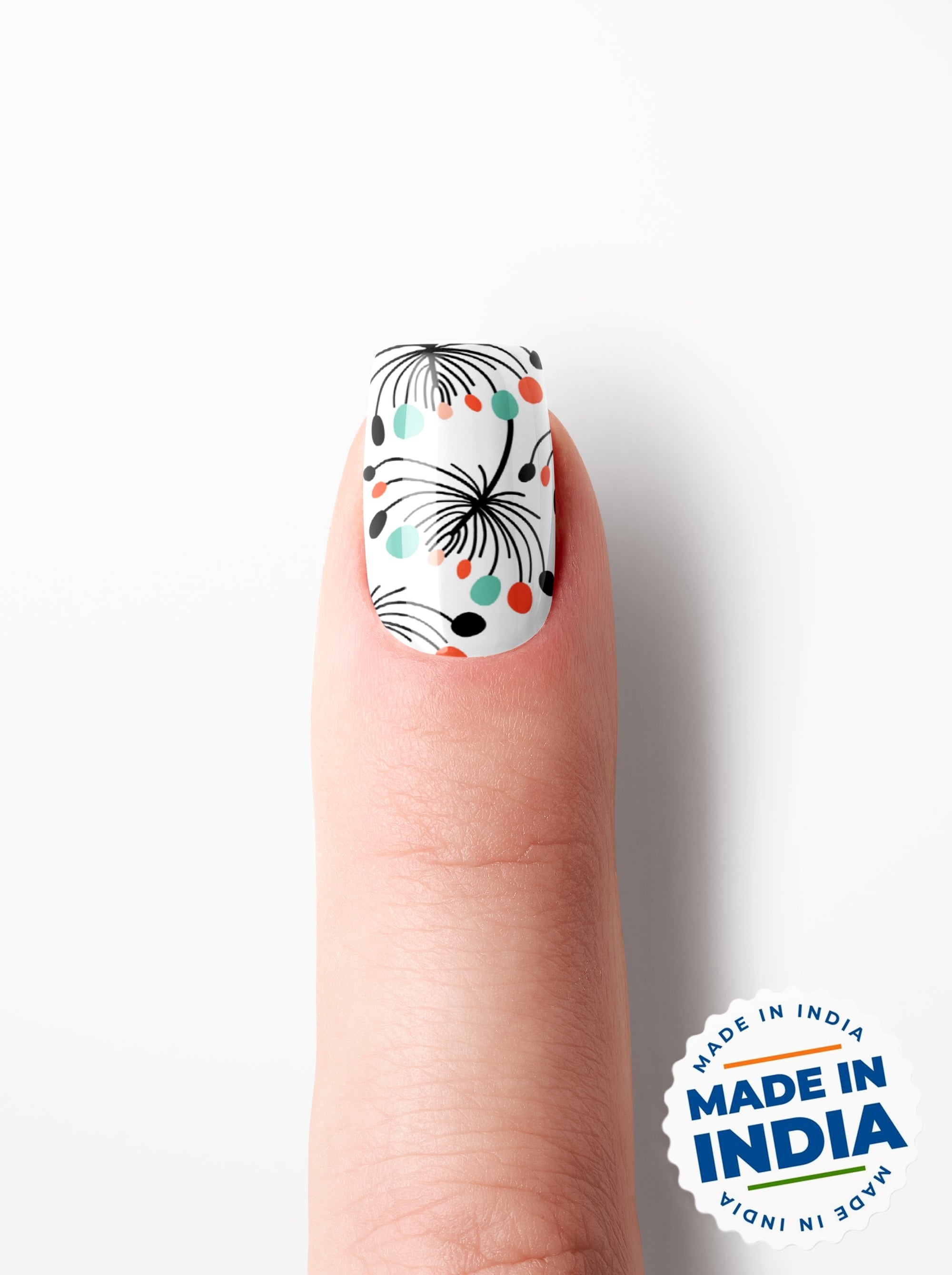Nail with floral design on a white background with 'Made in India' label