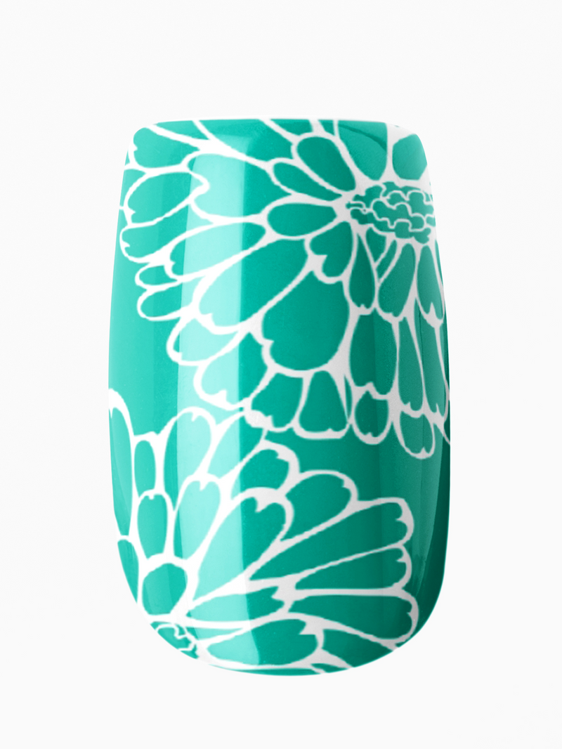 Teal floral-patterned cup on a white background